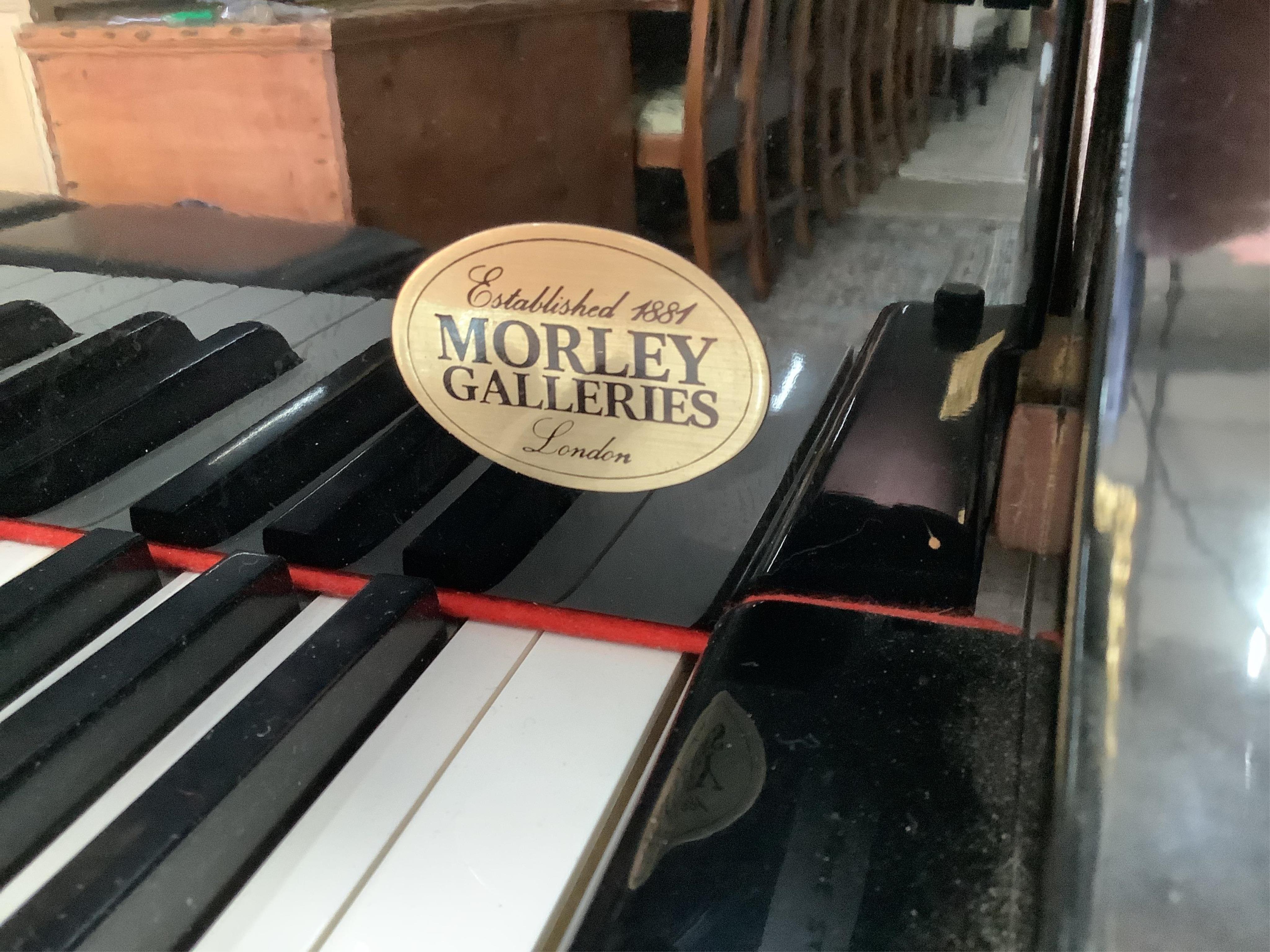 A modern Elysian ebonised baby grand piano, length 160cm, width 148cm, height 101cm, and a duet stool. Condition - good